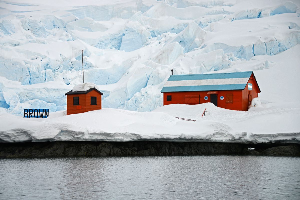 04B Two Buildings At Almirante Brown Station With Avalanche Glacier Behind From Zodiac On Quark Expeditions Antarctica Cruise